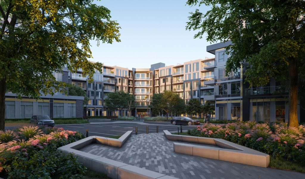 A landscaped forecourt with paved seating walls and flowering beds, framed by trees, leading to the entrance of a mid-rise condominium building.
