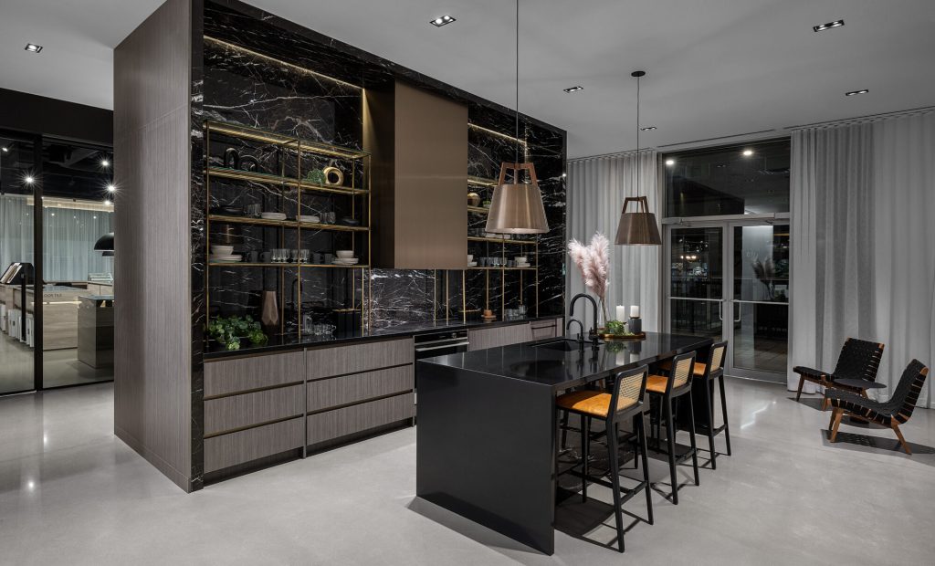 Design studio kitchen display with three island finishes side by side