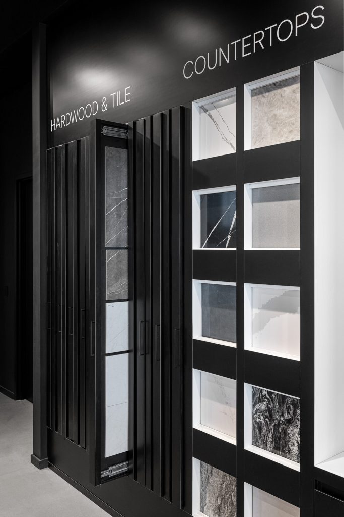 Floor and wall tile samples displayed in a full-height rack